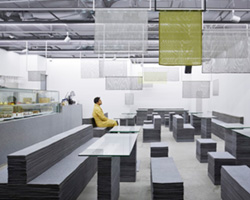 nameless architecture's stacked felt furniture creates a soft + solid café interior
