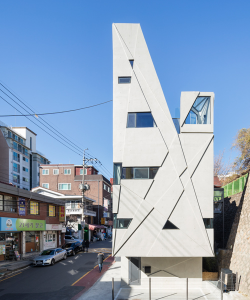 moon hoon completes mixed-use building in seoul with small, angled windows
