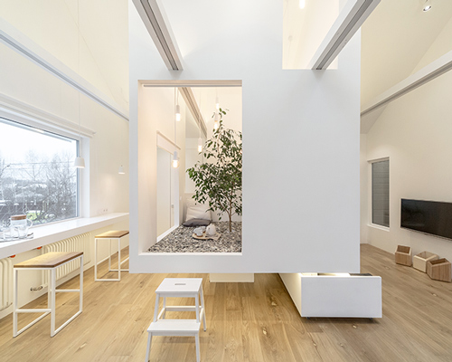 ruetemple adds multi-functional cube to living room in moscow