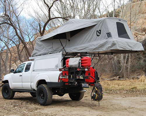 take camping to the next level with AT overland's tacoma habitat levitating tent
