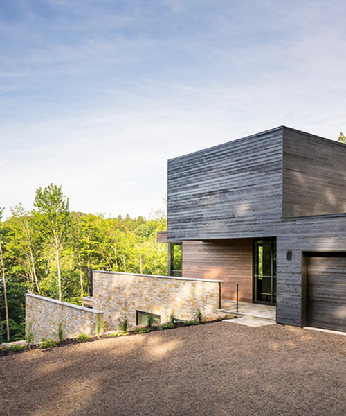 house in the laurentian forest follows a tripartite composition
