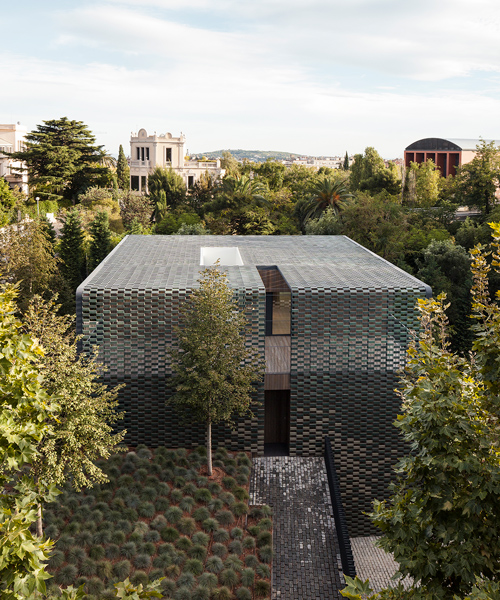 PMMT camouflages TR house in barcelona with green ceramic tiles