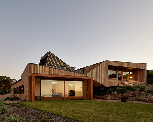 bkk architects designs split level house on offset topography