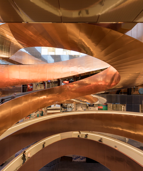 CEBRA reopens denmark's experimentarium science center with giant copper stairway