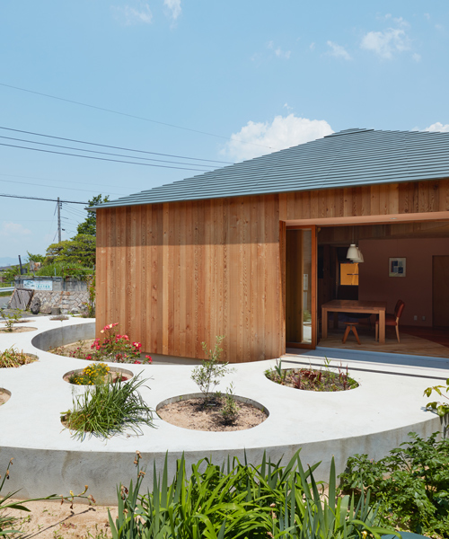 fujiwaramuro architects designs a house in hiroshima with a circular planted pathway