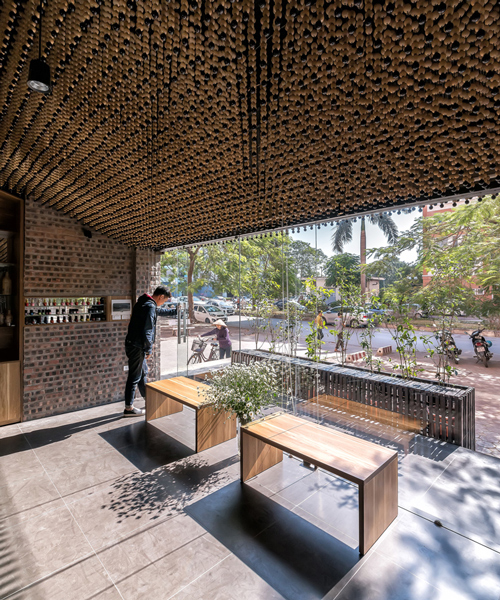 H&P architects install a ceiling of beads inside vietnamese hair salon