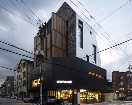 l'eau design sculpts moai building as a symbiotic structure in seoul