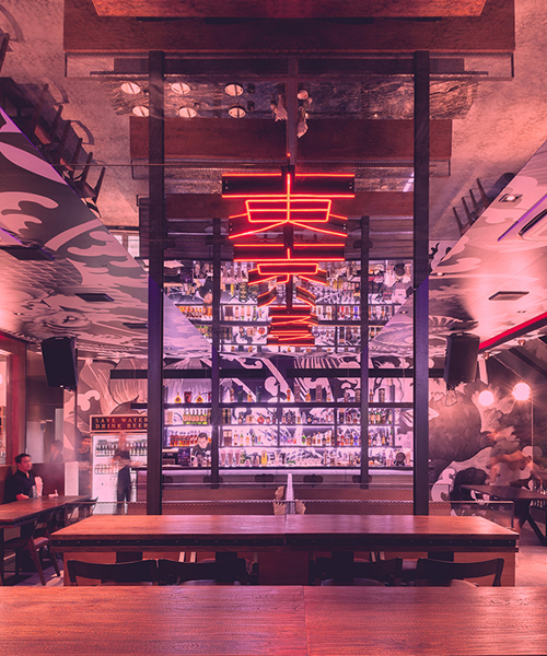 PHTAA living design's neon-lit restaurant evokes japanese anime culture