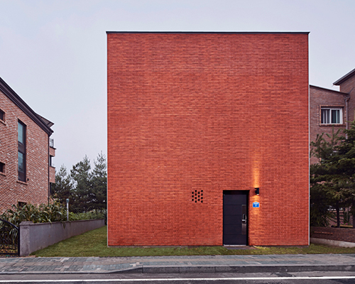 archiworkshop's 'red square house' features two windowless brick-clad façades