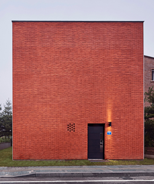 archiworkshop's 'red square house' features two windowless brick-clad façades