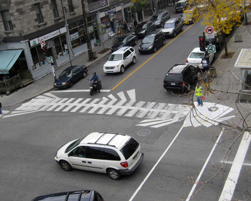 roadsworth adds to asphalt with surreal street art scenes