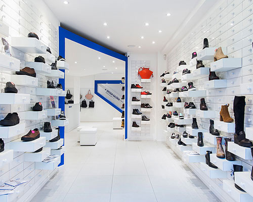 miklós kiss encases budapest footwear store in brilliant white metro tiles