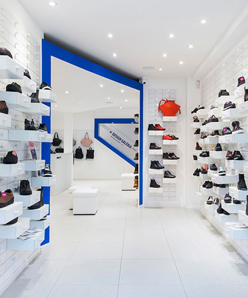 miklós kiss encases budapest footwear store in brilliant white metro tiles