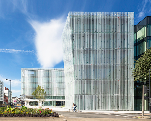 AIA associes clads HQ for french bank in white silk-screened glass façades