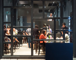 INRE studio installs dessert restaurant within vietnamese row house