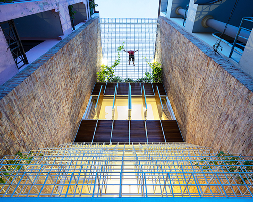 white grid inserted into vietnamese townhouse by block architects