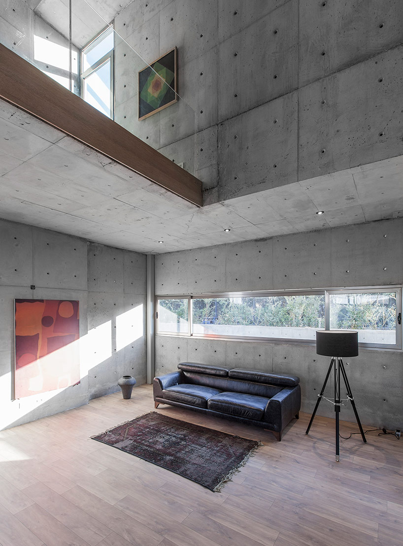 bracket design studio completes concrete villa 131