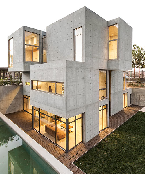 bracket design studio completes concrete villa 131