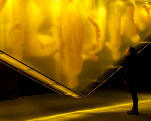 david spriggs' gold, ghostly figures turn the 'wealth pyramid' on its head