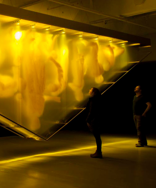 david spriggs' gold, ghostly figures turn the 'wealth pyramid' on its head