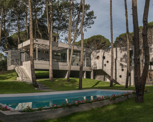 estudio galera elevates concrete house in argentina above the site's sand dunes