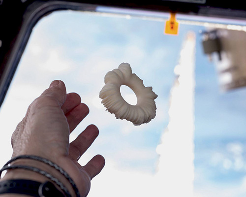 eyal gever's 3D-printed 'laugh-star' becomes first artwork created in space
