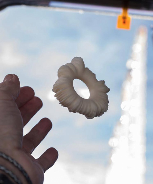 eyal gever's 3D-printed 'laugh-star' becomes first artwork created in space