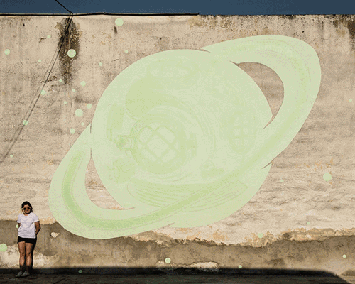 glow-in-the-dark street art by reskate studio reveals secret messages by night