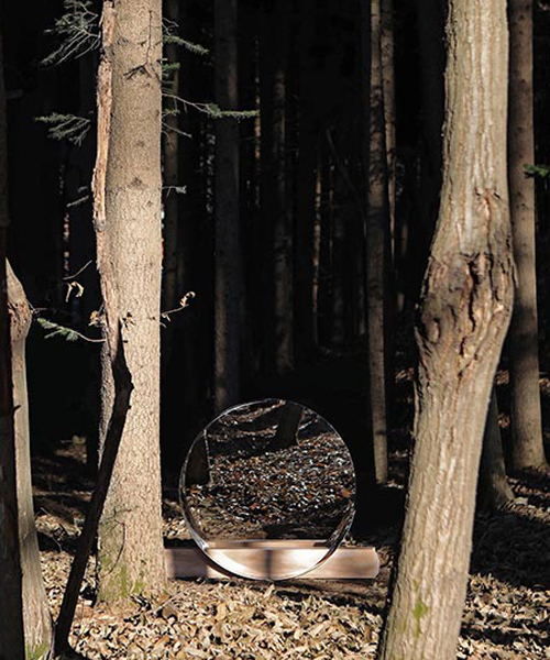 jinsik kim's halfhalf round mirrors distort forested landscapes