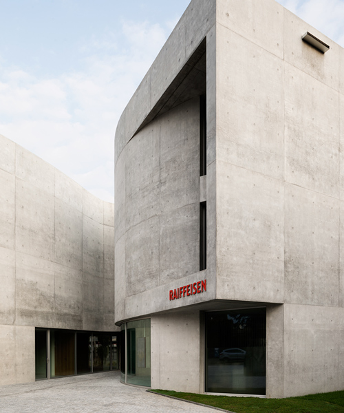 montemurro aguiar's concrete bank mediates between historic swiss town & industrial context
