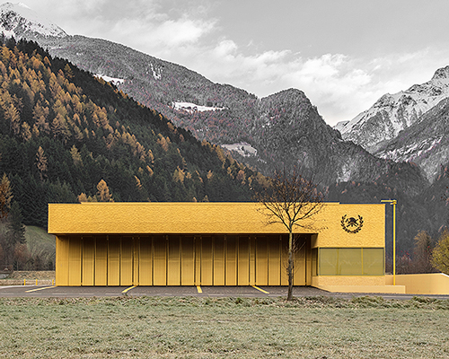 pedevilla architects paint fire station mustard yellow in northern italy