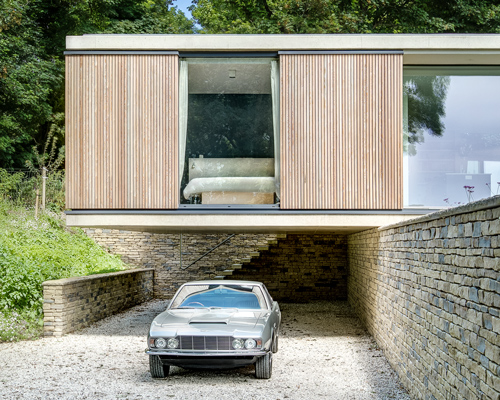 ström architects cantilevers modern-day bungalow in england from a stone wall