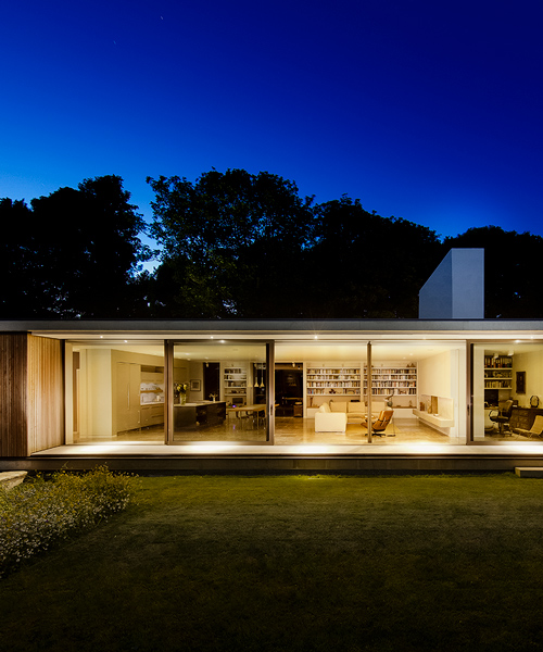 ström architects cantilevers modern-day bungalow in england from a stone wall