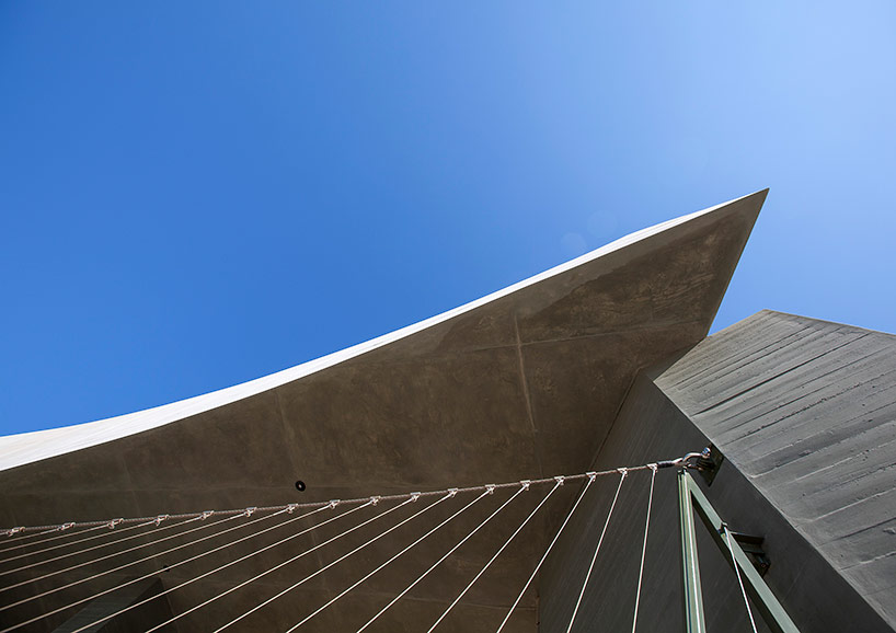 tense architecture network sculpts house in crete from sun angles