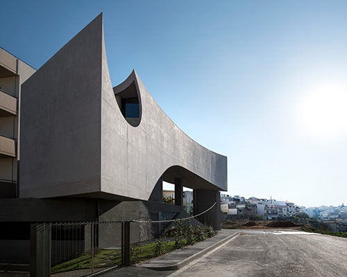 tense architecture network sculpts house in crete from sun angles