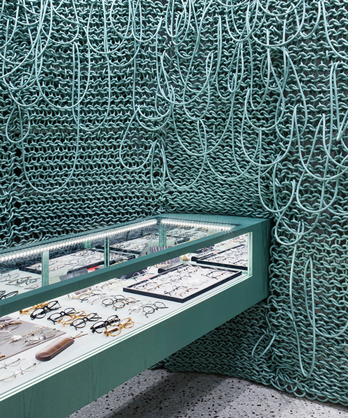 wall of knitted wires seen inside eyeglass store in seoul by wallga + WGNB