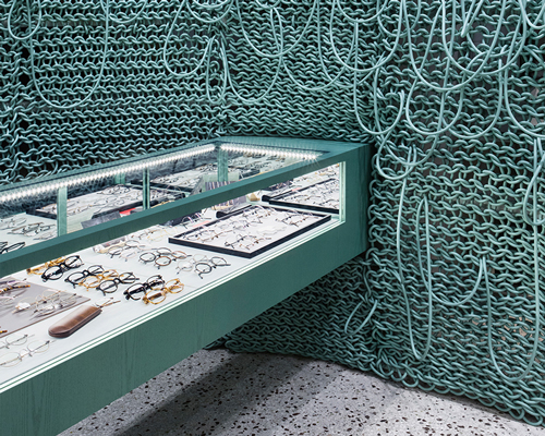 wall of knitted wires seen inside eyeglass store in seoul by wallga + WGNB