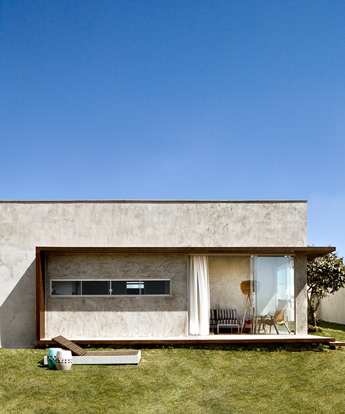 1:1 architetura:design places concrete box house on sunny site in brazil