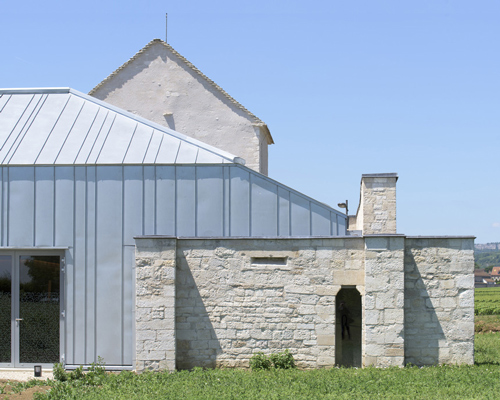 JUNG architectures transforms former hospital in france with zinc-clad extension