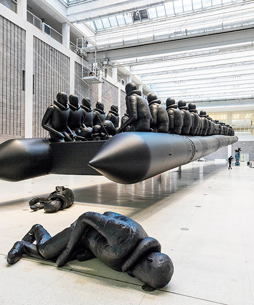 hundreds of figures squeeze into ai weiwei's suspended rubber raft at the national gallery, prague