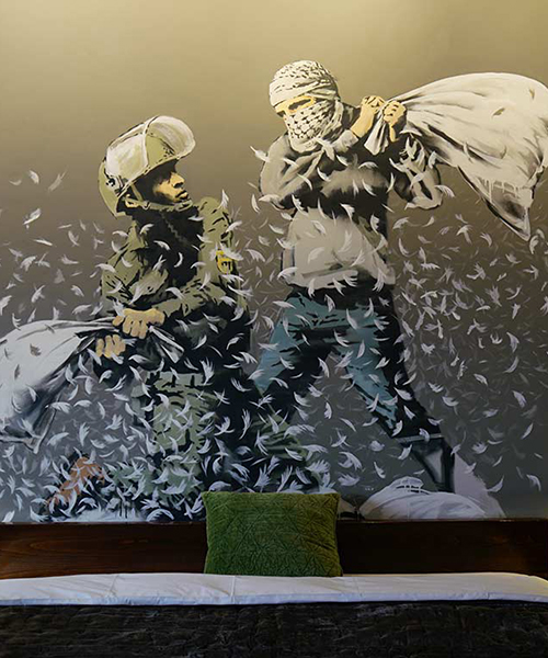 banksy opens 'the walled off' art hotel in bethlehem
