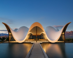 steyn studio's bosjes chapel in south africa is crowned with a sculptural roof canopy