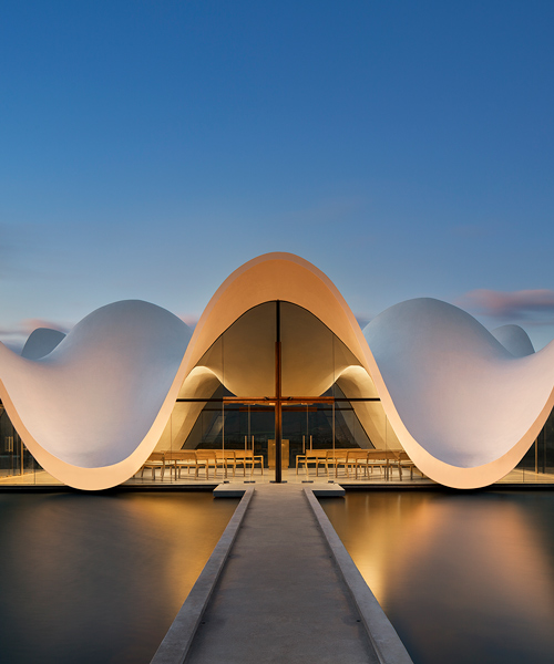 steyn studio's bosjes chapel in south africa is crowned with a sculptural roof canopy
