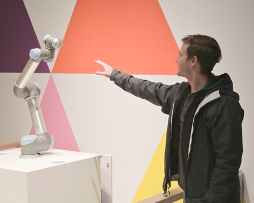 timid robot arm shies away from human touch until it learns to trust you