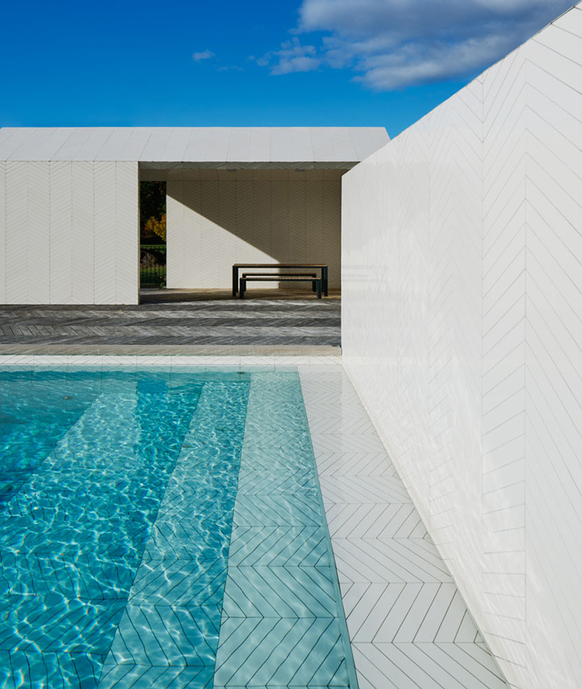 claesson koivisto rune wraps entire swedish pool and spa in parquet tiles