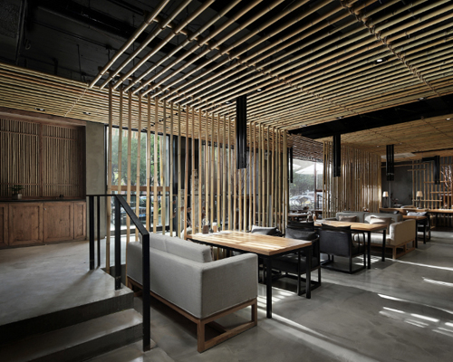 minggu design installs bamboo canes as visual guides in chinese eatery