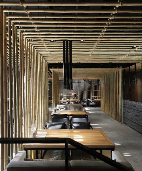 minggu design installs bamboo canes as visual guides in chinese eatery