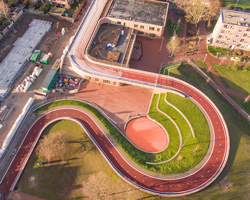 this bridge in utrecht allows cyclists to bike over the roof of school