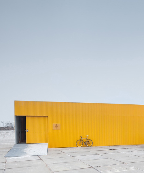 space encounters' mellow-yellow healthcare centre revives industrial hub in amsterdam
