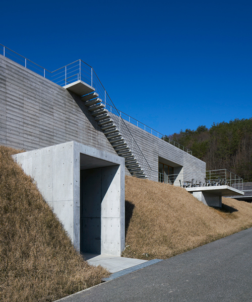 masamichi katayama / wonderwall embeds concrete winery into hillside in japan